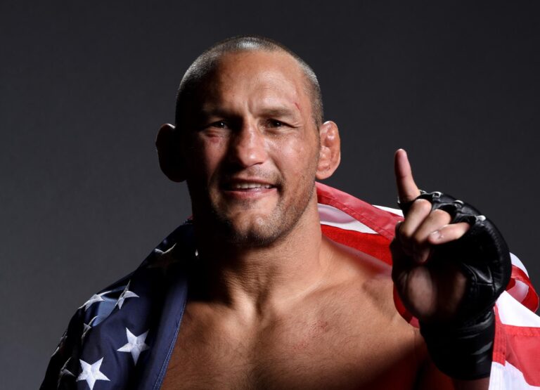 Dan Henderson posing with flag