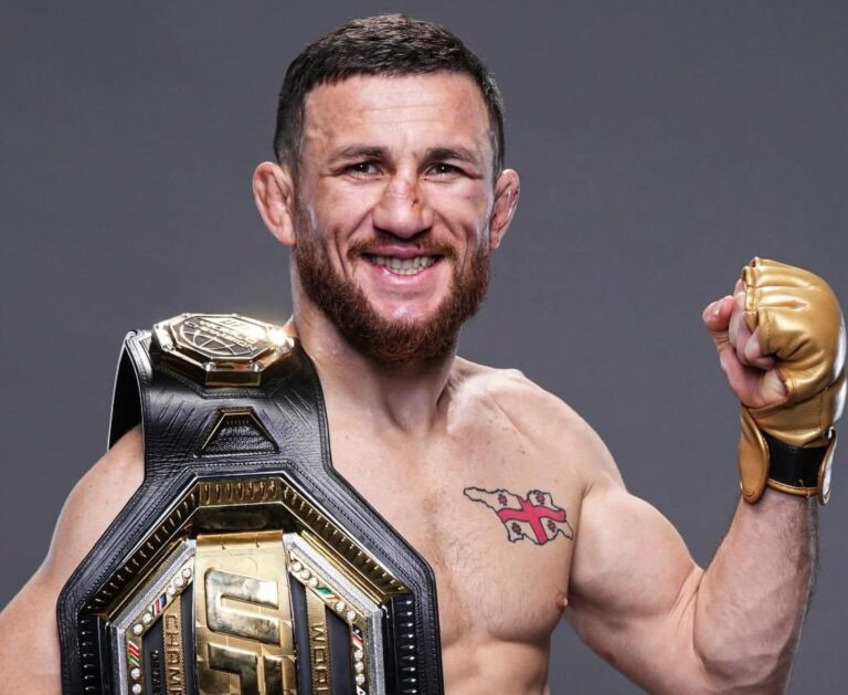 Merab Dvalishvili posing with belt